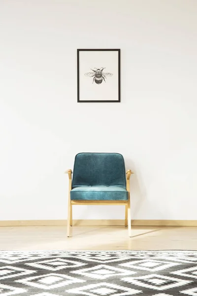 Simple room with blue armchair