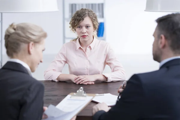 Stressed young girl and recruiters — Stock Photo, Image