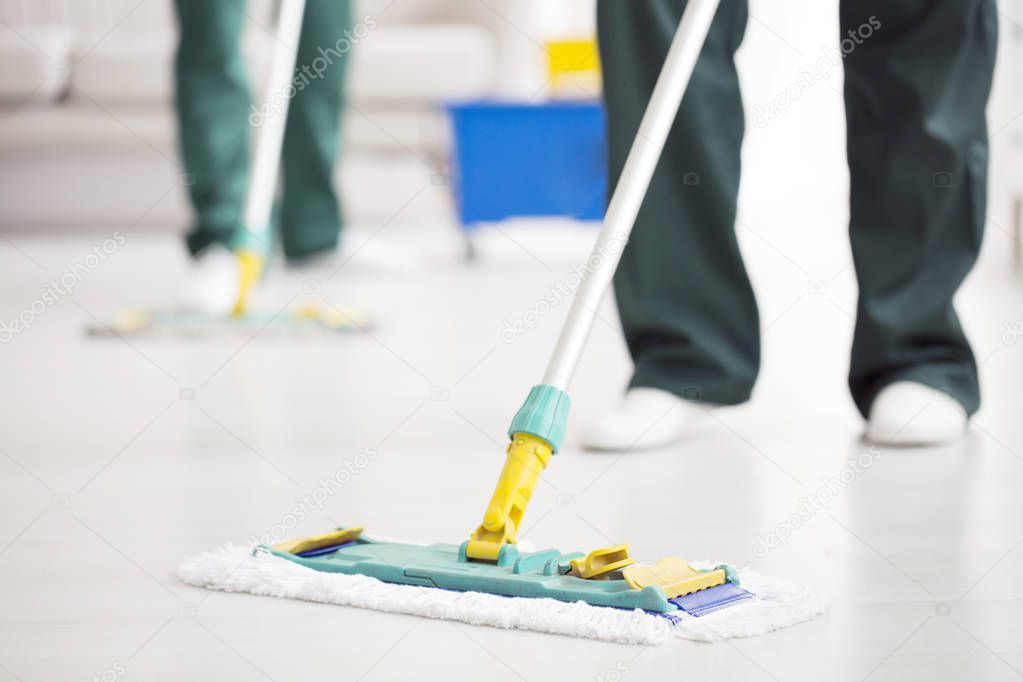 Person holding floor mop
