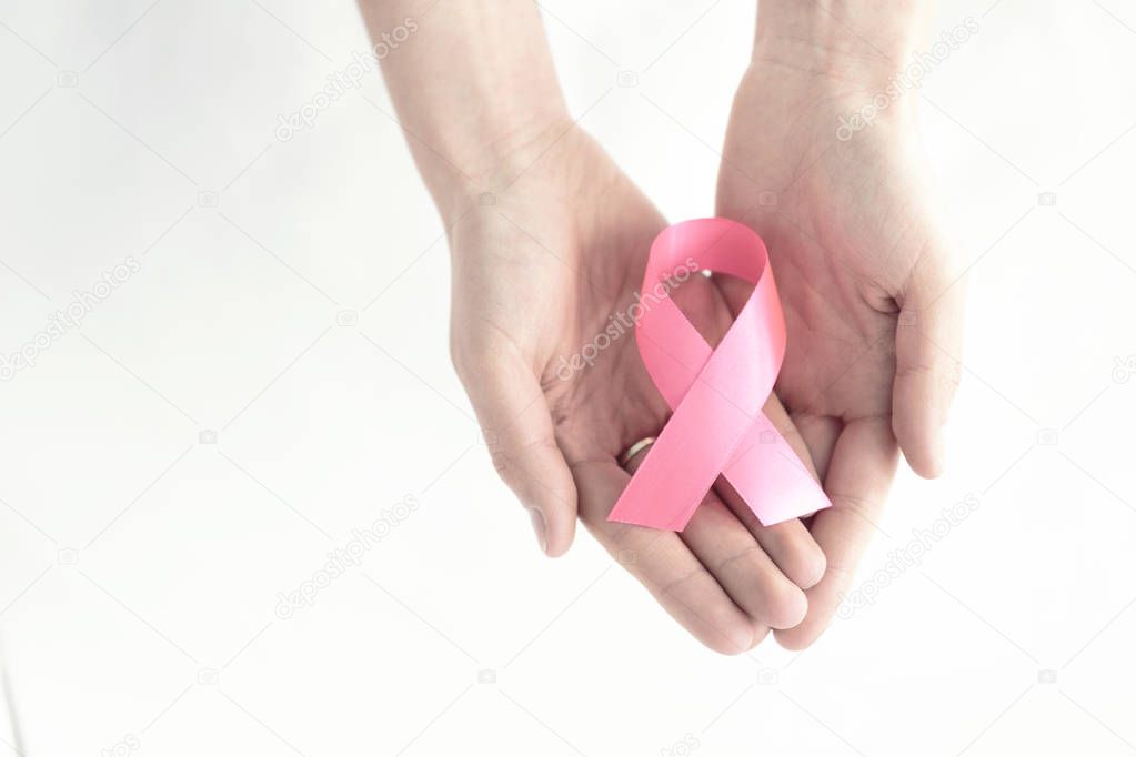 Hands with pink ribbon