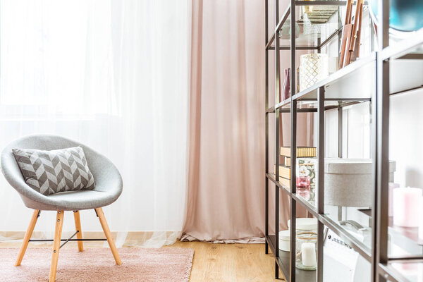 Black rack and gray armchair