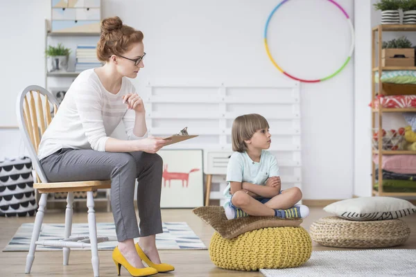 Offended young boy and teacher — Stock Photo, Image