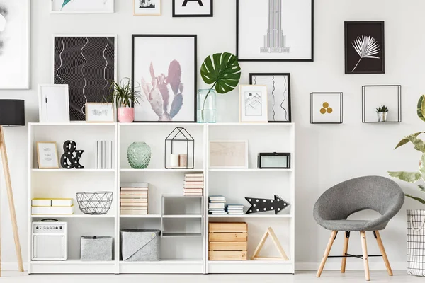 Grey armchair and shelf — Stock Photo, Image