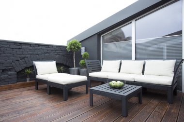 White garden furniture on terrace clipart