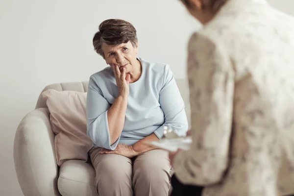 Sad senior woman during appointment — Stock Photo, Image