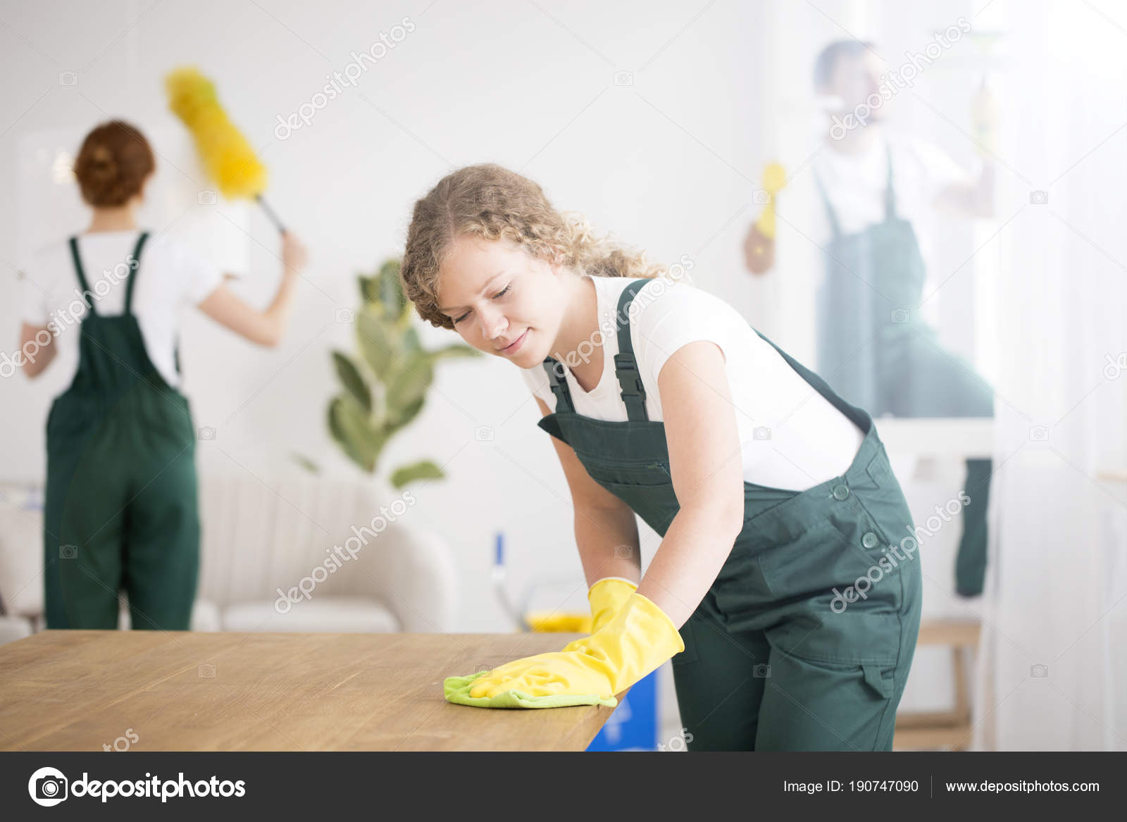 Woman wiping the table Stock Photo by ©photographee.eu 190747090