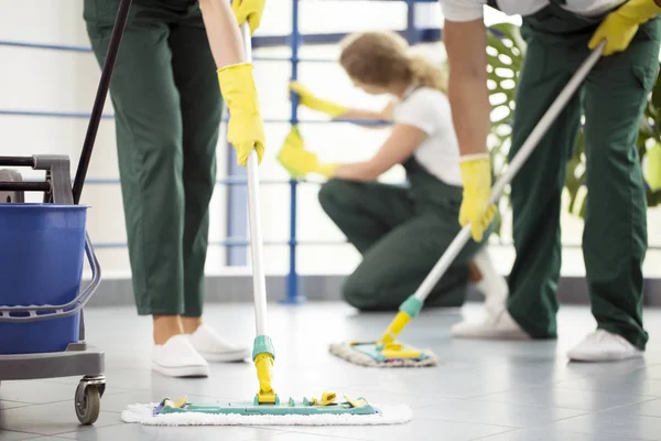 Moping floor and cleaning railing — Stock Photo, Image