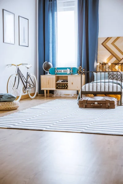 Leather suitcase in bedroom interior — Stock Photo, Image