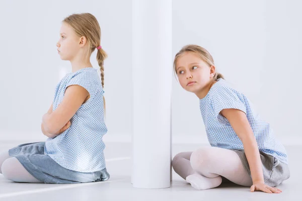 Offended girl and twin sister — Stock Photo, Image