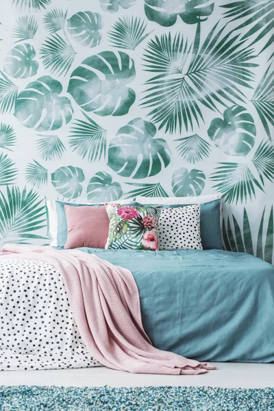 Turquoise bed by leaves wallpaper