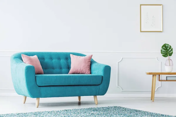 Turquoise sofa in minimalist interior — Stock Photo, Image