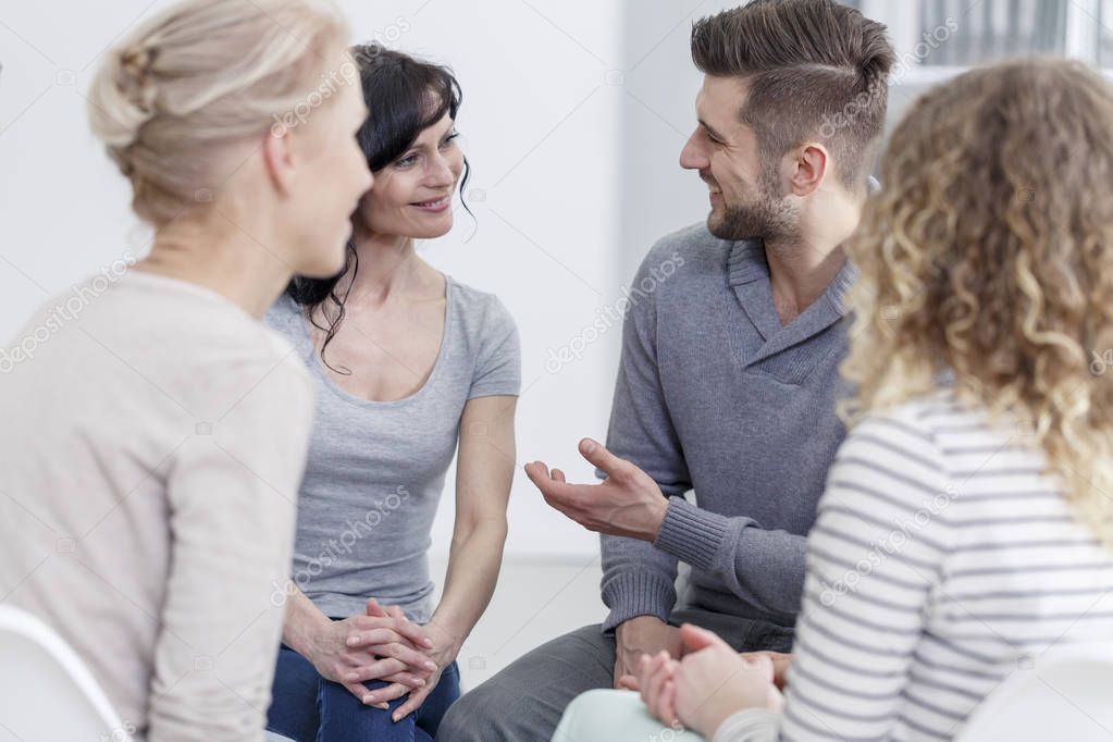 Man talking to woman