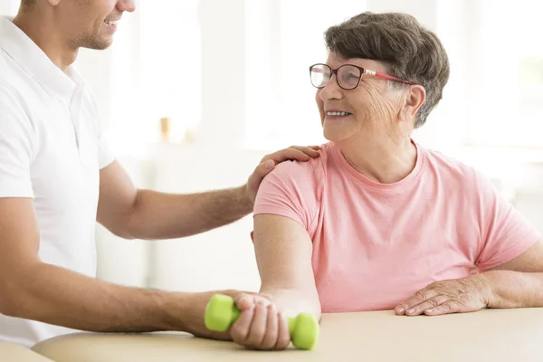 Older woman in physical rehabilitation — Stock Photo, Image