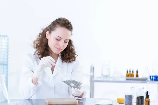 Laborer woman taking a sample — Stock Photo, Image