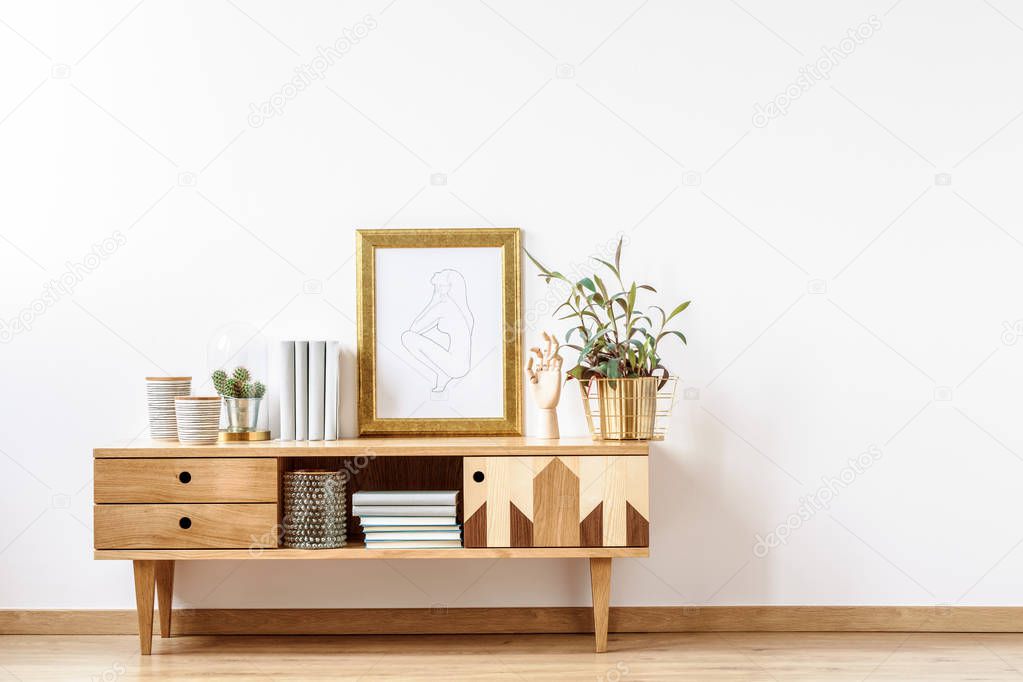 Wooden cabinet by empty wall