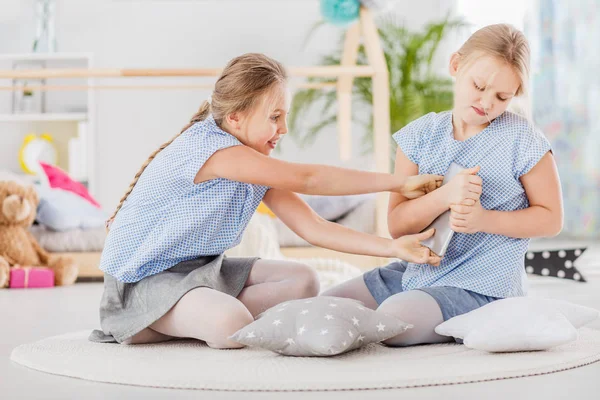 Girl Trying Grab Tablet Her Twin Sister Who Does Want — Stock Photo, Image