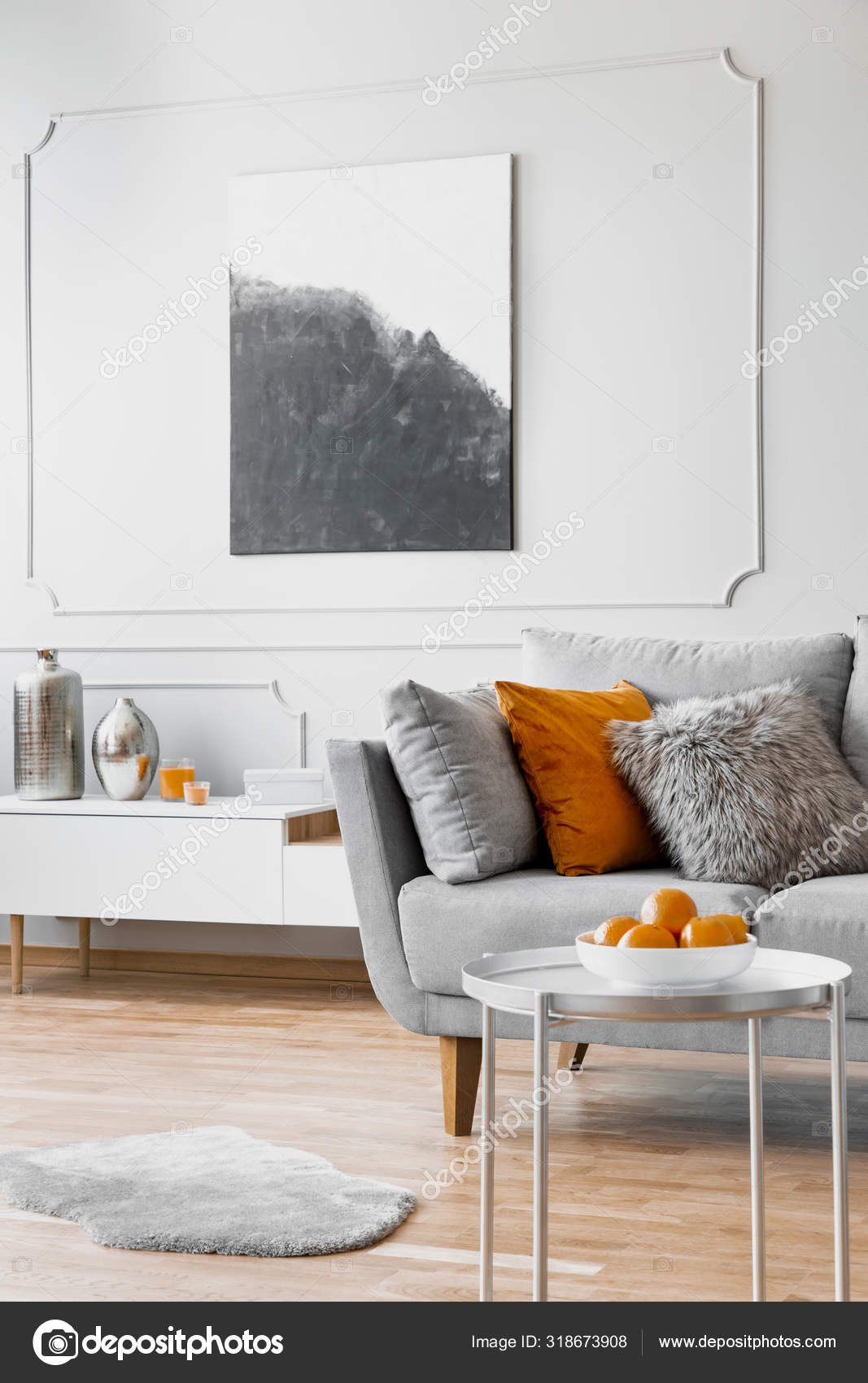 Pillows on comfortable sofa in bright living room interior Stock