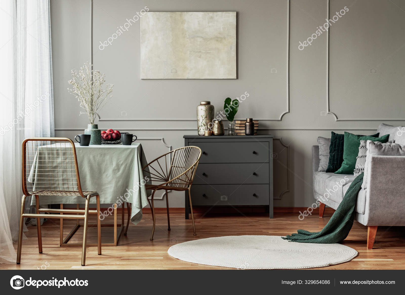 Elegant living and dining room interior with green and grey design