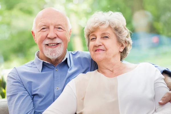 Cute senior couple siting together at home — 스톡 사진