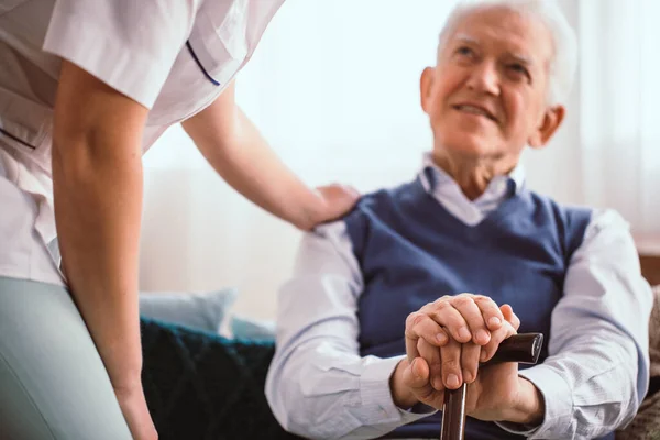 Senior Happy Man Walking Stick Sitting Couch Talking Nurse — Stock Photo, Image