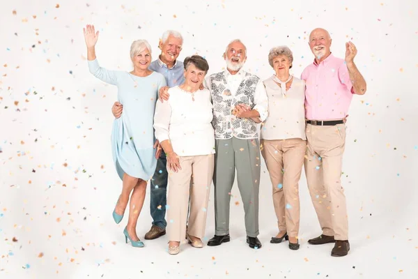 Happy Senior Friends Standing Group Celebrating Together Empty White Room — Stock Photo, Image