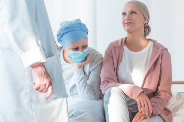 Young women suffering from cancer waiting for surgery clipart