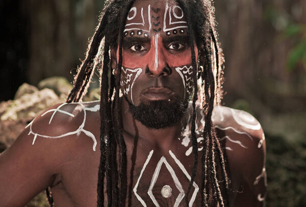 Portrait of the Taino Indian with dreadlocks and red body painti
