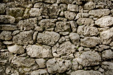structure of an ancient wall made of large stones clipart