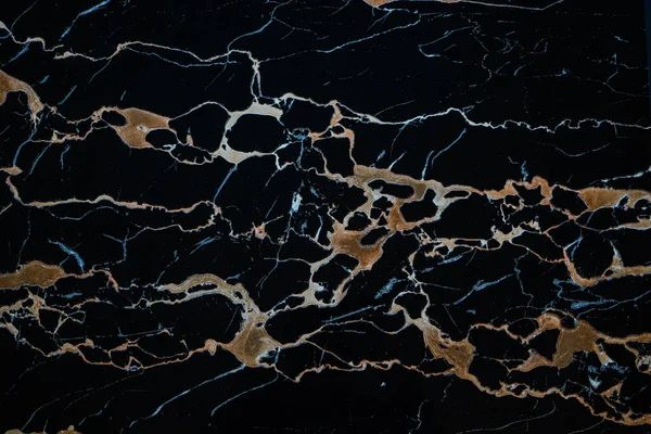Black marble slab with yellow streaks for facing, landscape, interior. Royalty Free Stock Photos