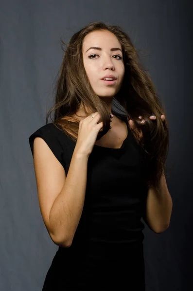 Beautiful girl in black dress — Stock Photo, Image