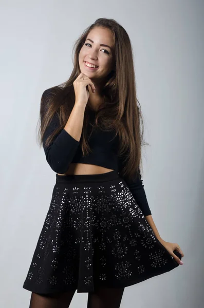 Beautiful girl in skirt and top — Stockfoto