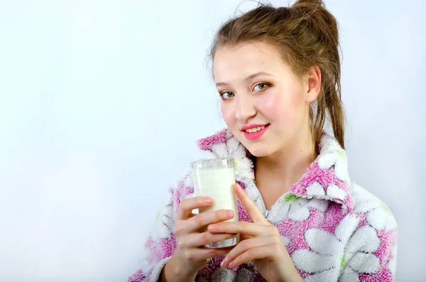 beautiful girl in pajamas with milk