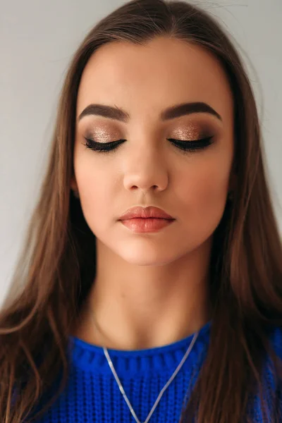 Model closed her eyes to show her makeup