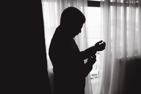 Silhouette of groom in the morning at hotel — Stock Photo, Image