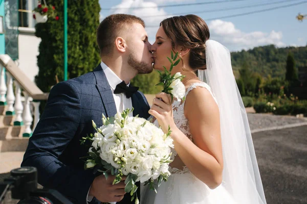 First look of groom and bride by the church — стоковое фото