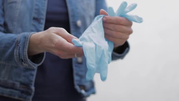 Close up of woman take on medical gloves — Stock Video