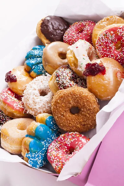 Box of colorful assorted donuts in pink box. — Stock Photo, Image