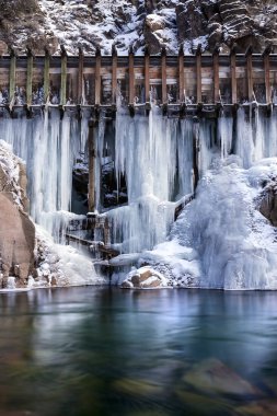 Old logging water flumes with icicles forming from leaks. Along the Truckee River near the California, Nevada, Border. clipart