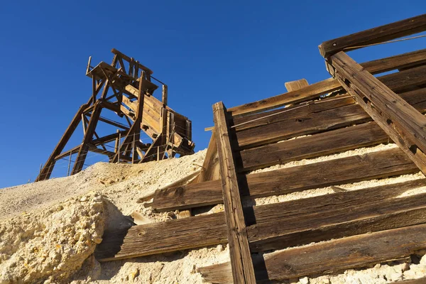Old wooden mining hopper bin under blue sky in the Nevada Desert near a ghost town. — Stock Photo, Image