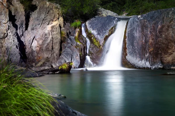 Waterfall and calm aqua marine peaceful pond. Indian Springs, CA — Stock Photo, Image