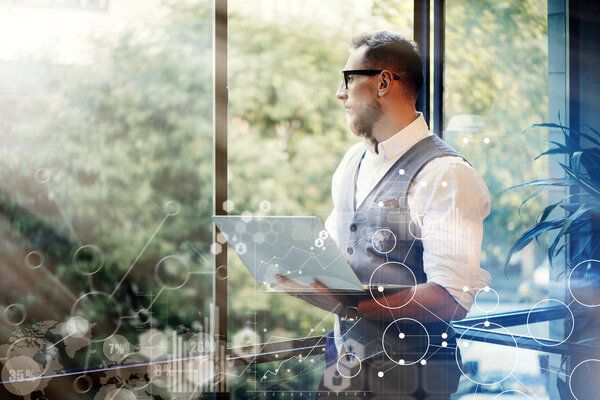 Man Holding Laptop in Hands