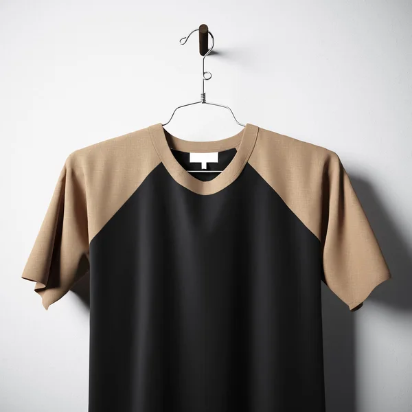 Closeup of blank cotton tshirt brown and black colors hanging in center empty concrete wall. Clear label mockup with highly detailed texture materials. Square. Front side view. 3D rendering. — Stock Photo, Image
