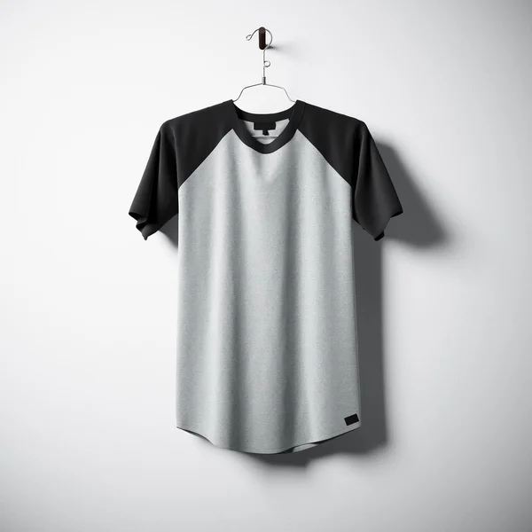 Blank cotton tshirt of gray and black colors hanging in center empty concrete wall. Clear label mockup with highly detailed texture materials. Square. Front side view. 3D rendering. — Stock Photo, Image