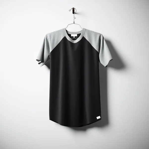 Blank cotton tshirt of black color hanging in center empty concrete wall. Clear label mockup with highly detailed textured materials. Square. Front side view. 3D rendering. — Stock Photo, Image