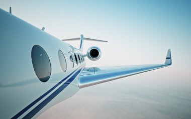 Özel jet bulutların üzerinde uçan