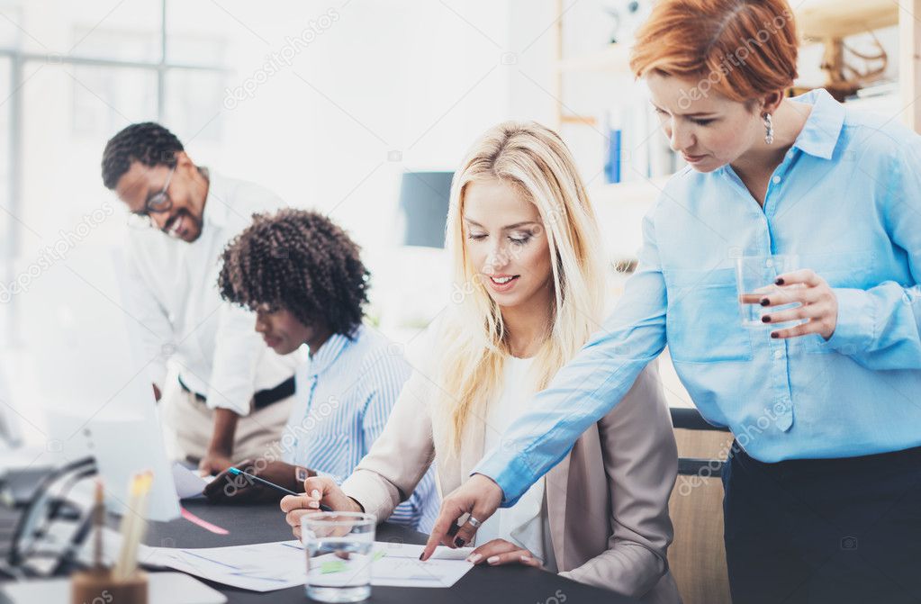 Group of coworkers discussing business plans