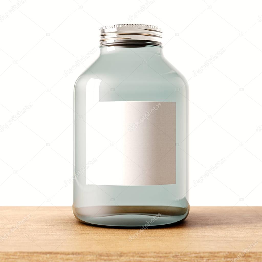 One empty jar of transparent glass with closed metal cap on the wood desk.White wall at background.Clean glassy container and gray mockup label.Drinks,food storage concept.3d rendering.