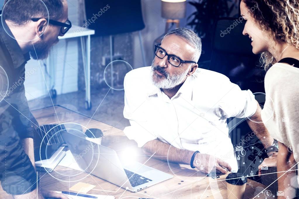 Concept of digital screen ,virtual connection icon,diagram, graph interfaces.Bearded man talking with marketing director and assistant manager.Business people meeting.Horizontal.