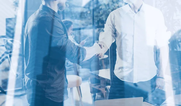 Double exposure concept.Business partnership handshake.Photo two bearded businessmen handshaking process.Successful deal after great meeting in modern office e.Horizontal closeup, blurred background . — стоковое фото