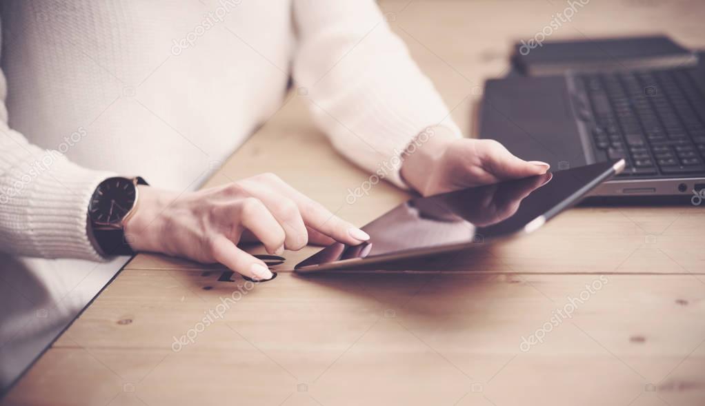 female hands touching tablet